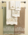 Soft and feminine, the Venetian Scroll wash towel marries a delicate look with durable Egyptian cotton. Swirling blossoms embroidered in creamy shades bloom on muted sage, ivory and linen for serene elegance.