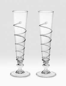 Hand-placed threading winds around a pair of beautiful, mouthblown Champagne flutes in single spirals to create a look that's both traditional and contemporary. Boxed set of 2 9 high Dishwasher safe Imported