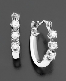 Tiny hoops add subtle sparkle to your look with glittering round-cut diamonds (1/8 ct. t.w.). Earrings set in 14k white gold. Approximate diameter: 1/4 inch.