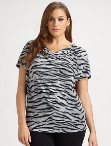 A bold print enlivens this feminine cowlneck top. Pair it with solid-colored pants or a pencil skirt.CowlneckShort sleevesAllover printPull-on styleAbout 25 from shoulder to hemPolyester/spandexMachine washImported