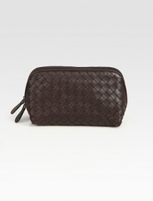 Rich woven leather has goldtone hardware detail. Top zip with two pull tabs Canvas lining 4½H X 7½L X 2W Made in Italy 