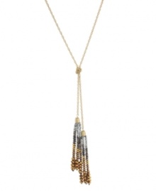 Dynamic duo. A decorative double tassel design has an exotic effect on Kenneth Cole New York's long necklace. Crafted in a combination of gold tone, brass tone and hematite tone mixed metal, it's adorned with a knot detail and bead embellishment. Approximate length: 30 inches +3-inch extender. Approximate drop: 6-1/2 inches.