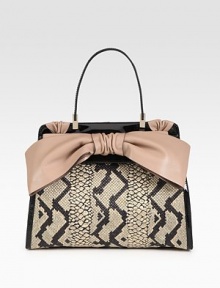 Chic python-printed straw meets supple leather in this sleek flap silhouette, finished with a demure leather bow.Top handle, 6½ dropFlap snap closureProtective metal feetOne inside zip pocketTwo inside open pocketsCotton lining14½W X 11H X 3½DMade in Italy