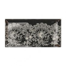 A dynamic large-scaled floral lace pattern in white on black creates a sophisticated blend of sweet and bold.