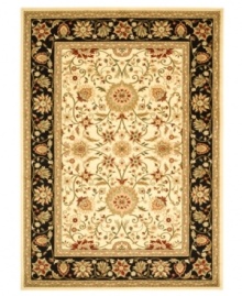 A fine finish for your living space. This Safavieh area rug comes alive with beautiful floral, vine and latticework detailing, all captured on a stunning ivory ground surrounded by a rich red border. Crafted from soft polypropylene, this rug radiates timeless allure with the added convenience of easy-care construction.