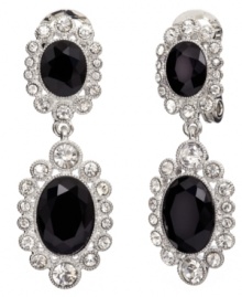 Dazzling and dramatic. Featuring a double-drop silhouette adorned with glittering crystal and glass accents, as well as jet resin, Monet's clip on earrings are sure to add sparkle to your evening style. Crafted in silver tone mixed metal. Approximate drop: 1-3/4 inches.