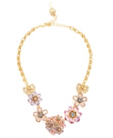 Breathe fresh air into your look with Betsey Johnson's breezy frontal necklace. Crafted in antique gold-plated mixed metal with pink, purple, blue and clear crystal-encrusted flower and ribbon charms. Approximate length: 16 inches + 3-inch extender. Approximate drop: 1-1/5 inches.