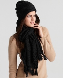 Bundle up in style. A chunky handknit scarf with knotted fringe trim.