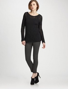 Dolman sleeves and a sleek boatneck complement wool-rich, semi-sheer crochet knit. Boatneck Long dolman sleeves Semi-sheer crochet Longer length hits below the hips 90% wool/10% nylon Dry clean Imported of Italian fabric