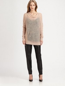 Long, semi-sheer sweater in a wool blend with a cowlneck, dropped shoulders and silken back panel. CowlneckDropped shouldersLong ribbed sleevesSilk back panelBody: 50% mohair/30% nylon/15% merino wool; Contrast: SilkDry cleanImportedModel shown is 5'9 (176cm) wearing US size Small.