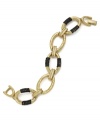 Urban chic. Chunky oval links wrapped with hematite tone chains pop on this trendy Alfani bracelet. Set in gold tone mixed metal. Approximate length: 7-1/2 inches.