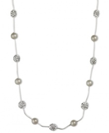 Get stranded in style with this captivating Anne Klein necklace. Embellished with sparkling glass stones and plastic pearls on a silvery strand. Set in silver tone imitation rhodium mixed metal. Approximate length: 16 inches.