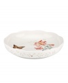 The whimsical butterflies and blooms of Butterfly Meadow dinnerware grace this shallow serving bowl, an irresistible way to serve everything from pasta and veggies, to cinnamon buns. With scalloped detail in white porcelain. From Lenox's collection of serveware and serving dishes. Qualifies for Rebate