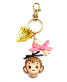 Monkey around. A sweet simian adorns Betsey Johnson's key chain, as do leaf, bone and bow accents. Embellished with glittering crystal details, it's set in gold tone mixed metal. Includes a gift box. Approximate length: 5 inches.