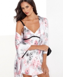 Darling pink and dramatic black meet in the middle with gorgeous effect on this feminine chemise by Jones New York.