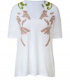 White cotton shirt with fresh floral embroidered design - Soft pink and warm green hues - Round neck with rolled hem - Half sleeves with loose cut - Try with skinny jeans and flat sandals or flared jeans and platform heels