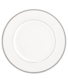 Lend a taste of glamor to any entree with the luminous Dentelle dinner plate. From innovative designer Monique Lhuillier, it features a platinum-edged tiered scallop pattern on creamy white.