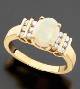 Beautiful oval-cut opal (1-1/2 ct. t.w.) looks positively angelic on this lovely ring featuring round-cut diamonds (1/3 ct. t.w.) set in 14k gold.