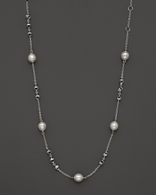 This sterling silver necklace, gleaming with freshwater pearls, makes an elegant statement. By Di MODOLO.