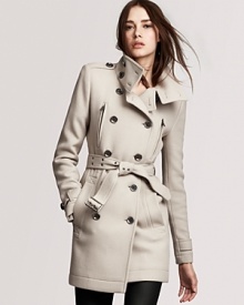 A funnel neck softens the structured silhouette of this Burberry Brit military-inspired coat--effortless allure at its best.