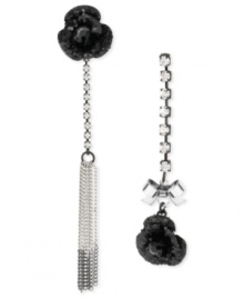 Everything's coming up roses. This pair of mismatch drop earrings from Betsey Johnson is crafted from silver-tone mixed metal with black glittery roses and glass accents for an eclectic touch of elegance. Approximate drop: 2-5/8 inches to 3-1/2 inches.