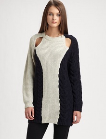 A modern and inventive take on the classic pullover, with unexpected shoulder cutouts, asymmetrical contrast panels and chunky cable-knit detailing.Ribbed crewneckLong sleeves with ribbed cuffsShoulder cutoutsContrast panelsRibbed hemAbout 31 from shoulder to hem66% wool/23% viscose/9% nylon/2% alpacaDry cleanImportedModel is 5'10 (177cm) wearing US size Small.OUR FIT MODEL RECOMMENDS ordering one size down as this style runs large. 