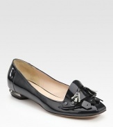 Sharp and sophisticated patent leather design, accented with a silver-edged heel, gunmetal studs and matching tassels.Self-covered heel, ¼ (5mm) Leather lining and sole Made in ItalyOUR FIT MODEL RECOMMENDS ordering one size up as this style runs small. 