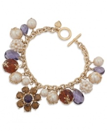 Charm your friends with this bracelet from Carolee. Features clusters of colorful epoxy stones and glass accents. Crafted in 12k gold-plated mixed metal with a toggle closure. Approximate length: 7-3/4 inches.