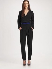 This silky, impeccably tailored one-piece is the epitome of minimal elegance.Surplice neckline with side notchesLong sleeves with underarm ventsBanded waist with belt loopsIncluded beltZip flyFront pleatsSide slash pocketsInseam, about 3351% acetate/49% viscoseDry cleanMade in USA of Italian fabricModel shown is 5'10 (177cm) wearing US size 4. 