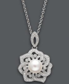 Natural inspiration. This stunning open-cut flower pendant features a single cultured freshwater pearl (8-9 mm) surrounded by round-cut diamond encrusted petals (1/5 ct. t.w.). Setting and chain crafted in sterling silver. Approximate length: 18 inches. Approximate drop: 1-1/4 inches.