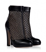 Take a rocker-chic stance on sophistication this season in Valentinos studded ankle boots, accented with sleek black leather trim for an edgy elegant finish - Rounded toe, snapped ankle strap with cut-out, back zip, blocky heel - Pair with leather leggings and chunky modern knits