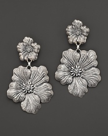 Delicate gardenias, captured at the height of their beauty in sterling silver, bloom on these earrings from Buccellati.