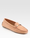 Tried-and-true leather moccasin with detailed stitching and a signature goldtone buckle that forms two T's. Nubuck leather upperLeather liningRubber solePadded insoleMade in ItalyOUR FIT MODEL RECOMMENDS ordering true size. 