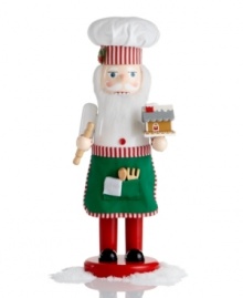 Inspiring all kinds of magic in the kitchen, the Chef Santa nutcracker dons a hat and apron trimmed in candy stripes. A miniature gingerbread house and wooden baking tools add to his merriment.