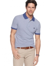 Classic simplicity in a modern cut. This slim-fit polo shirt from Izod will easily become a mainstay in your wardrobe. (Clearance)