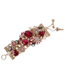 Embrace your versatile side with Betsey Johnson's statement-making toggle bracelet. Crafted in antique gold tone mixed metal, this wide multi-link bracelet features fuchsia-colored crystal gems, glass pearls, gold tone heart lock with pink-colored crystal accents and hematite crystals with crown base. Approximate length: 7-1/2 inches.