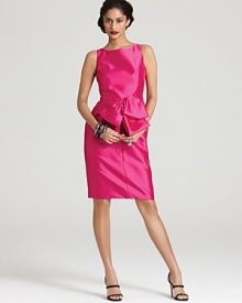 An oversize bow at the waist lends feminine charm to this richly hued and impeccably tailored Carmen Marc Valvo dress.