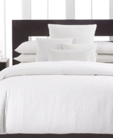 Clean and simple. Calvin Klein's Mykonos duvet cover, inspired by the Greek island of the same name, features a white-on-white circle design for a classic appeal. Hidden button closure.