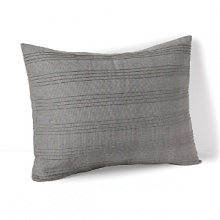 Bring an effortless touch of modernity to your home. Contrasting stripes create a hand-crafted effect on this chic Calvin Klein decorative pillow.