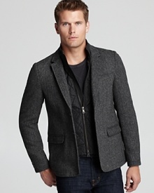 A trend-right look with a removable faux vest panel, this dapper sport coat hits the mark in classic herringbone.