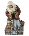 Santa kneels at the manger of little baby Jesus & glances adoringly down at the true reason for the season. Alive in deep hues and a mix of folk-inspired patterns, this figurine touches at the heart of Christmas.