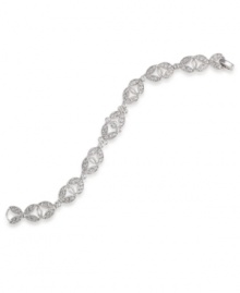 Define and refine your style in this elegant bracelet by Carolee. Sparkling glass stones highlight an ornate link pattern crafted in silver tone mixed metal. Approximate length: 7-1/4 inches.