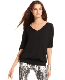 Dramatically full sleeves and a keyhole in back create a captivating look on INC's petite tunic top.