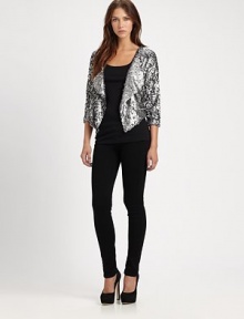 Embrace the wow factor in this cropped sequin blazer with dolman sleeves and a contour hem. Oversized shawl collarThree-quarter dolman sleevesContoured cropped back hemAbout 23 from shoulder to hemViscoseDry cleanImportedModel shown is 5'9 (176cm) wearing US size Small.