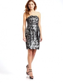 Metallic floral brocade shapes this short and sexy design with beaded embellishment along the waist.Strapless Pleated bodice Beaded waist Side slash pockets Back zipper with hook-and-eye Fully lined About 36 from shoulder to hem 56% acetate/44% polyester Dry clean Imported