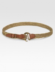 A metallic rope offset by a rustic brass hook closure blends rugged style with graceful femininity.Hook buckleAbout 1½ wideJute, leather, and brassImported