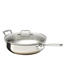 The cornerstone of your successful kitchen, Emeril's sauté pan brings versatility to your range with a heavy-gauge stainless steel construction, high sides and a flared lip for drip-free pouring. The ideal companion for frying and searing, this pan features a tempered glass domed lid that traps in flavors and moisture. Lifetime warranty.