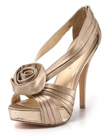 An oversized rosette and glitter-encrusted platform add feminine details to Enzo Angiolini's Slendor sandals.