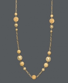 A touch of gold to brighten your look. Charter Club necklace features a long design that can be layered. Crafted in gold tone mixed metal with small glass beads. Approximate length: 42 inches + 2-inch extender.