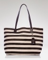 The classic canvas tote is synonymous with timeless style. With leather trims and bold stripes, this style from Olivia Harris is a luxe version.